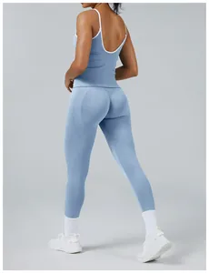 Back view of light blue color-block workout set with backless top and tight leggings