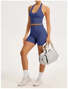 Seamless blue yoga set with racerback bra and high-waisted gym shorts on a model