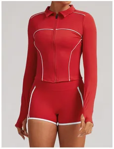 Red yoga two-piece set with long-sleeved zipper jacket and contrast white piping.