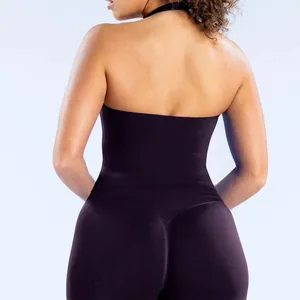 Back view of a dark purple seamless halter neck yoga tank top and leggings set