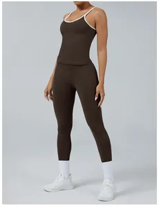 Front view detail of two-piece brown yoga set featuring contrast white trim design