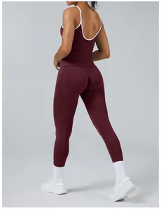 Back view of burgundy yoga set featuring contrast trim and high-waisted leggings