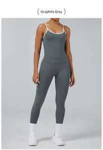 Detail of graphite grey sports set featuring contrast trim tank top and matching leggings