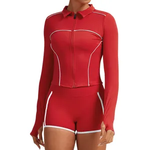 Vibrant red two-piece yoga workout set featuring contrast piping and zip-up long sleeve jacket