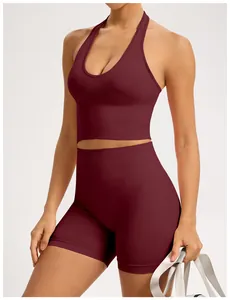 Detail view of burgundy seamless yoga set featuring halter top and high-waisted shorts
