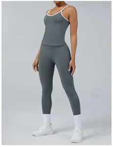 Close-up detail of grey yoga set featuring color-block sports tank and high waist leggings