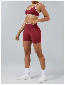 Detailed view of colorblock burgundy yoga set with sports bra and high-waist tight shorts