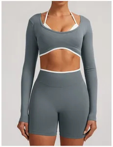 Women's seamless long sleeve yoga top with a fake two-piece design and white contrast trim