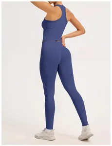 Premium blue seamless yoga set with racerback tank top and ribbed high-waist leggings.