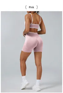 Back view of pink two-piece yoga set featuring high-waisted shorts and sports bra