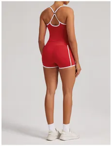 Rear view of a red yoga tank top and shorts set with white trim and crisscross back