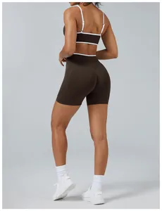 Back view of women's brown colorblock yoga set featuring high-waisted lifting shorts