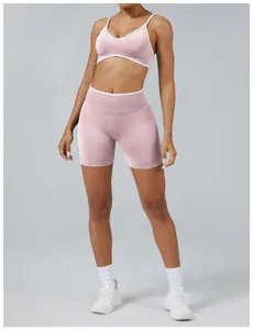 Front view of pink and white color-block sports yoga set featuring ribbed texture and slim fit