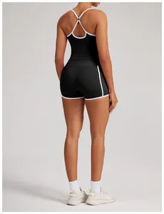 Back view of professional black and white color block yoga tank top with cross back straps