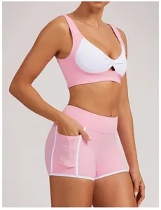 Conjunto de shorts de yoga y sujetador deportivo en rosa y blanco con bolsillo lateral