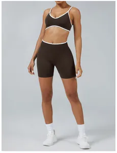 Two-piece dark brown yoga set with white contrast trim and high waist sports shorts