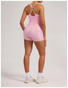 Back view of pink yoga set with white trim, featuring racerback tank and tight shorts