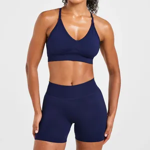 Professional detail of navy blue seamless sports bra and high-waist yoga shorts set
