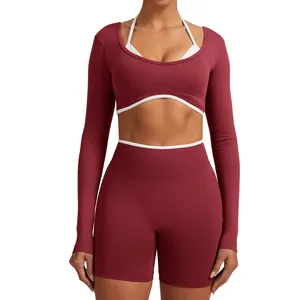 Seamless long-sleeve yoga set with mock two-piece top and matching fitness shorts