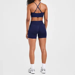 Professional back view of navy blue seamless yoga bra and high waist shorts gym set