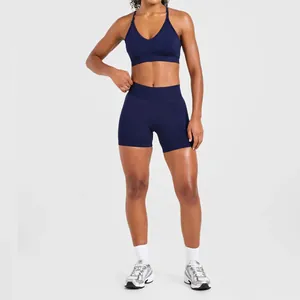 Detail of navy blue seamless high-strength sports bra and matching shorts for fitness