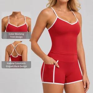 Women's contrast color yoga tank top and sports shorts set with a crisscross back design