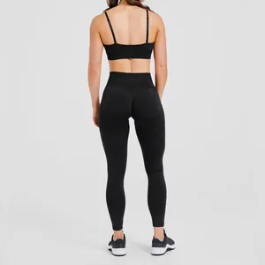Back view of a black seamless sports bra and high-waisted yoga leggings set.