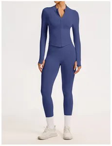 Close-up detail of the slate blue seamless ribbed sports jacket and leggings set