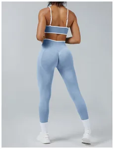 Back view of a two-piece blue and white color-block yoga set showing back and leggings details