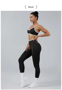Two-piece black and white colorblock sports bra and leggings set for yoga and gym