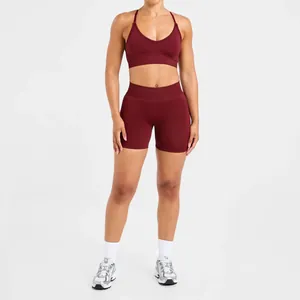 Full front view of a burgundy seamless yoga bra and matching high-waisted gym shorts set