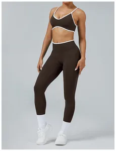 Two-piece brown and white color block yoga set with sports bra and high-waisted leggings.