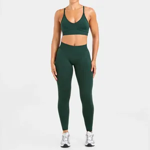 Full view of dark green seamless yoga set with sports bra and high-waist leggings.