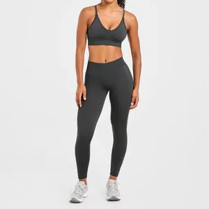 Professionelle nahtlose dunkelgraue Yoga-Leggings mit passendem Sport-BH-Set