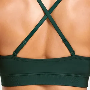 Detailed close-up showing adjustable back cross straps of dark green seamless bra