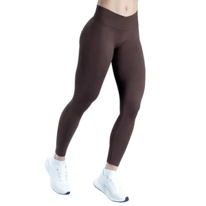 Women's seamless crossover waist yoga pants with ruched butt lift in matte brown finish.
