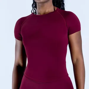 Detail shot of a seamless burgundy quick-dry athletic training t-shirt for women