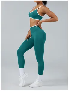 Side view of woman in teal and white contrast gym set with high-waist leggings