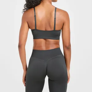 Back view of seamless charcoal yoga bra with double straps and matching high waist leggings