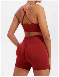 Back view of seamless burgundy yoga set showing high waist shorts and cross-back bra
