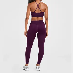 Back view of purple double-strap seamless yoga bra and leggings set for sports fitness