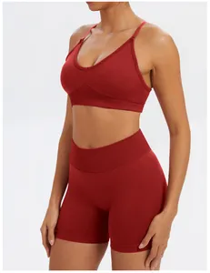 Detail of dark red seamless sports bra and high-waist shorts set for women