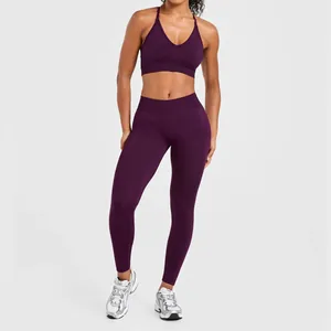 Full view of purple high-impact seamless yoga set worn by model in a studio setting