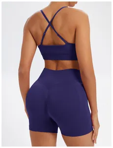 Rear view of navy blue seamless yoga set with cross-back sports bra and high-waisted shorts