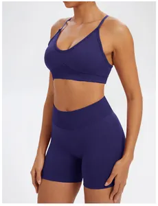 Detailed view of blue seamless yoga set sports bra and high-waisted gym shorts