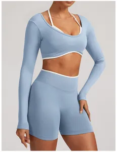 Detailed close-up of light blue seamless long sleeve yoga top and high waist shorts for women