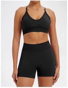 Detail of black seamless yoga set featuring a V-neck sports bra and high-waisted shorts.