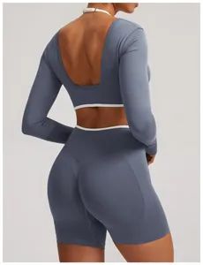 Back view of seamless ribbed yoga set with long-sleeved crop top and matching shorts