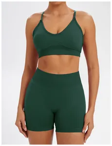 Close-up of dark green seamless yoga set featuring sports bra and high-waisted shorts