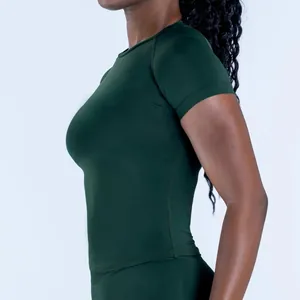 Side profile detail of dark green seamless compression gym t-shirt for women sports
